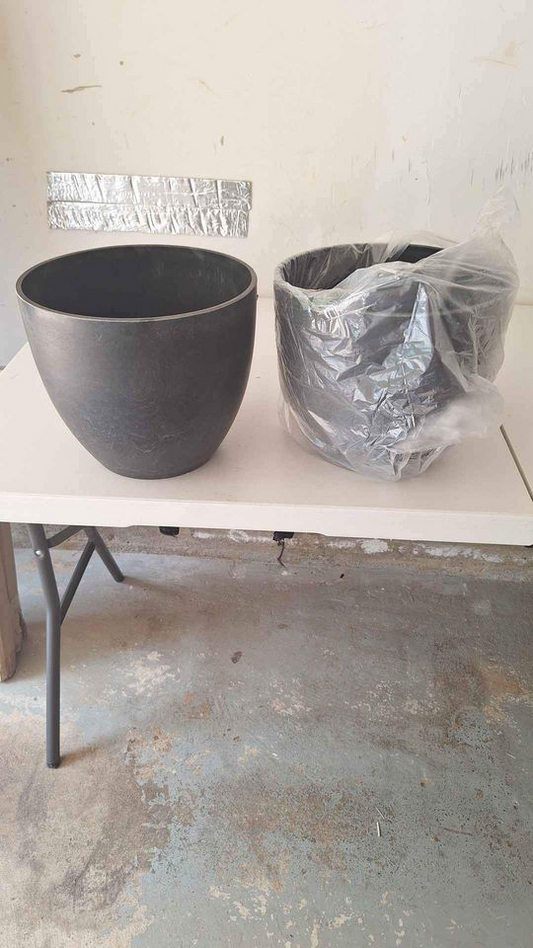 2 brand new black thick plastic vases